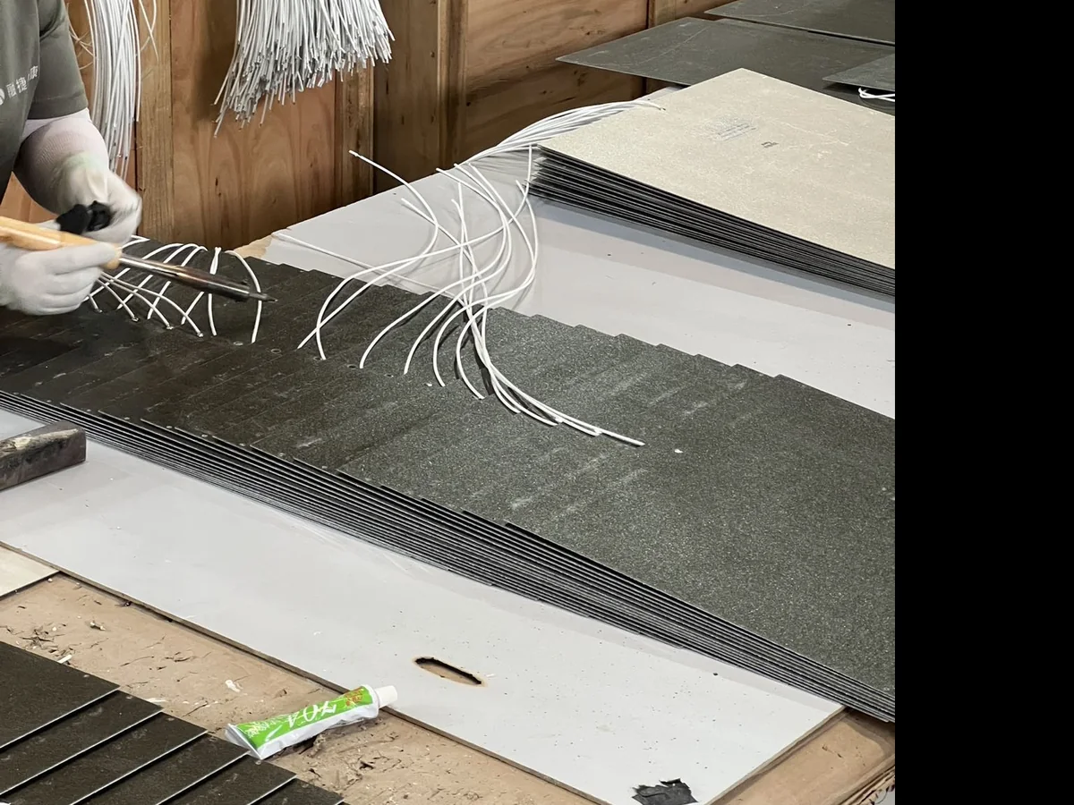 Graphene heating panels being assembled and wired at the Huian factory